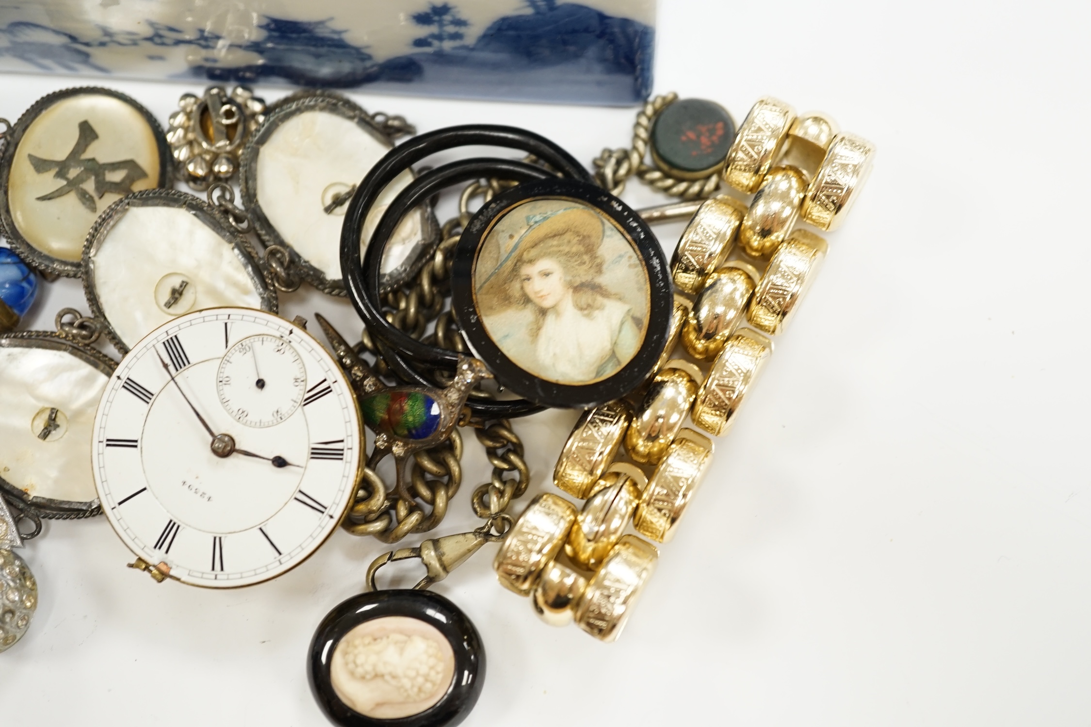 A quantity of assorted costume jewellery and watch movements.